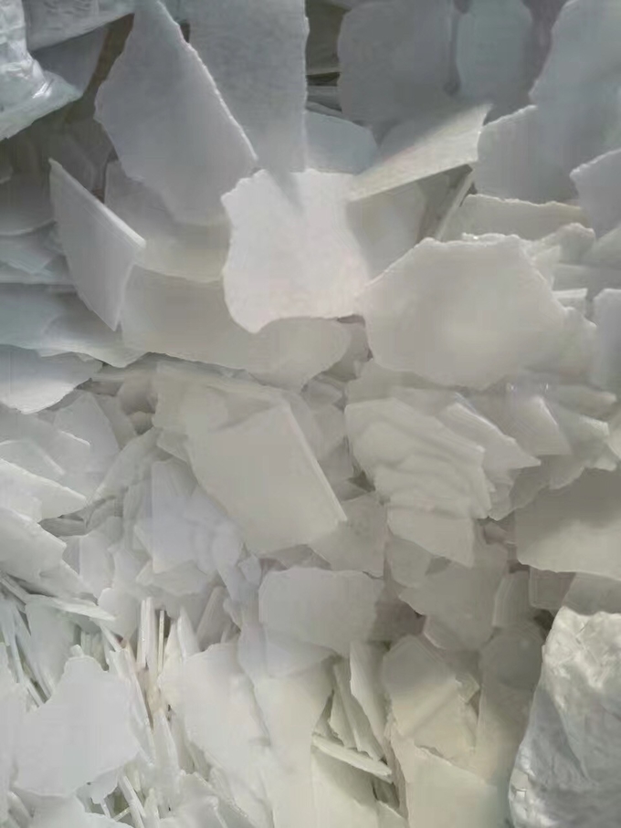 La soda cáustica 1310-73-2 del hidróxido de sodio gotea la pureza del 99% para la fabricación de papel